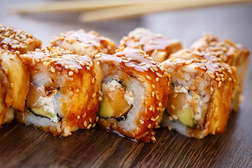 Sushi rolls served on wooden slate
