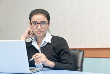 cute business woman with computer in office