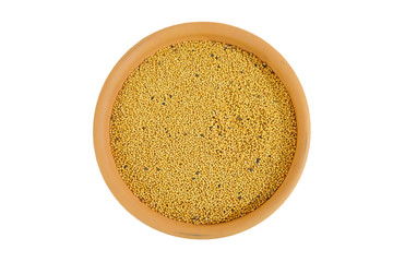 grain yellow mustard in a bowl. isolated on white