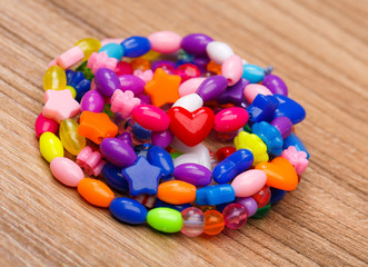 bead bracelet with beautiful handcrafted wooden background