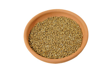 coriander seeds in a bowl. isolated on white