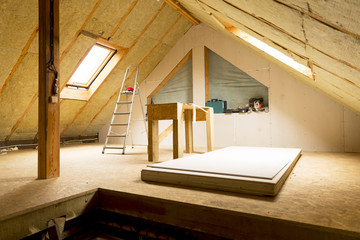 house attic under construction mansard wall insulation with rock wool - obrazy, fototapety, plakaty