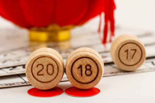 Wooden lotto barrels with numbers of 20 and 18 replace 17 as New Year 2018 is coming concept