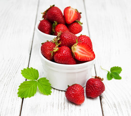 ripe strawberries on wooden table