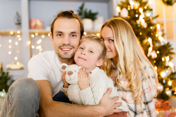 Beautiful family in Christmas interior