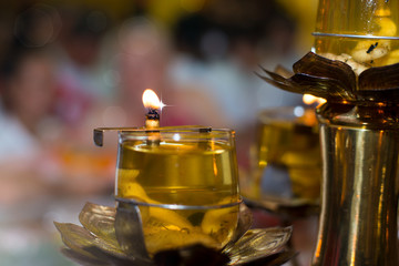 Oil lamp.Oil lamp burns brightly at shrine with bokeh and blurred background...