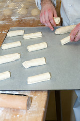 Baker preparing chocolate croissant