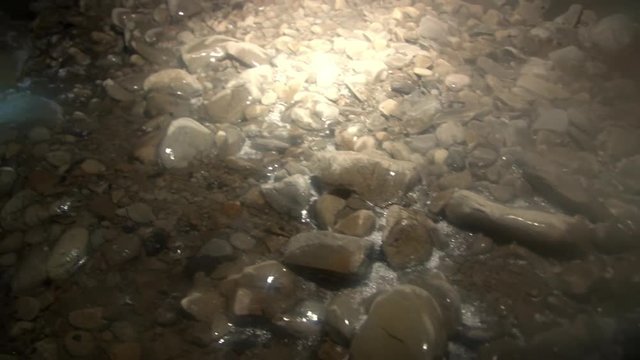 Icy stones in cave in Svalbard Arctic. Hollow place in in glacier. Eternal Frost. North Pole. Beautiful unique background. Ice desert landscape. Quiet of wilderness.