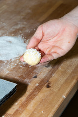 Baker preparing brioche with sugar