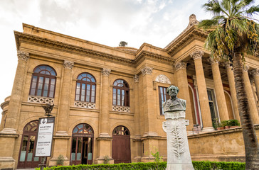 Fototapeta na wymiar A bust of Giuseppe Verdi in the garden of Theater Massimo Vittorio Emanuele, located on the Verdi square in Palermo, Sicily, Italy 