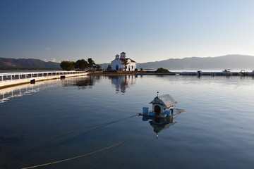 Peaceful morning on Elafonisos Island, Greece. The port of Elafonisos with view to Saint Spyridon church built on a small islet