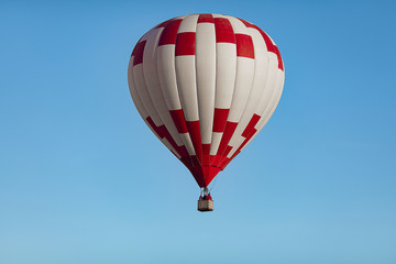 a huge, beautiful balloon in the cloudless blue sky closeup