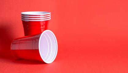Red party cup background template. Alcohol containers with negative copy space.