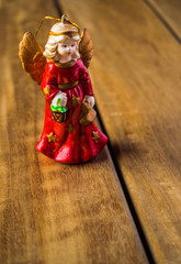 Angel figure tree on wood texture