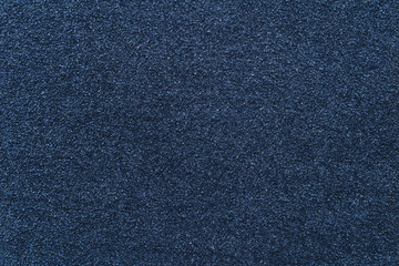 Background of dark blue cotton cloth with spools