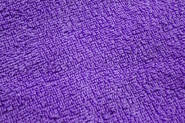 Lilac towel background, texture of cotton fibers of bath towel close up