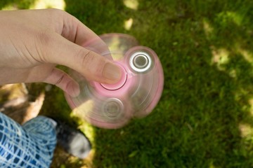 Girl playing with fidget spinner 