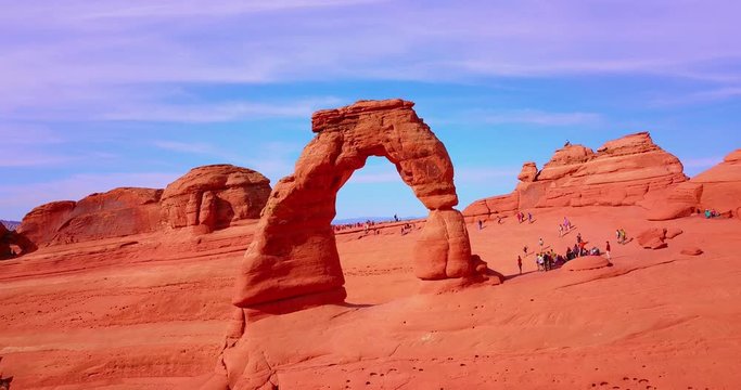 Red Stone Arch With Tourists Around An Overlook - Arches National Park, Utah