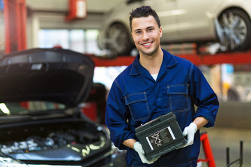 Car mechanic in workshop 