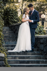 Fototapeta premium happy couple standing near modern city center