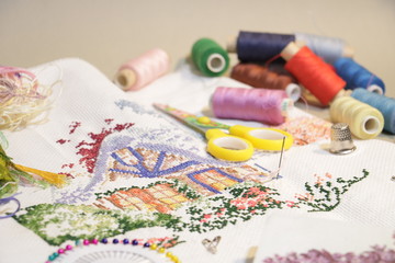 embroidered pattern and threads needle scissors 