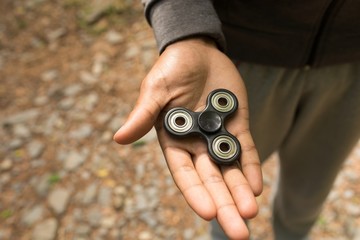 Man holding a fidget spinner
