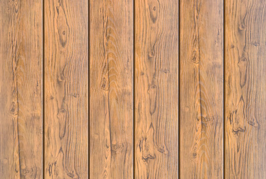 Background, the texture of brown wooden planks old with organic patterns closeup 