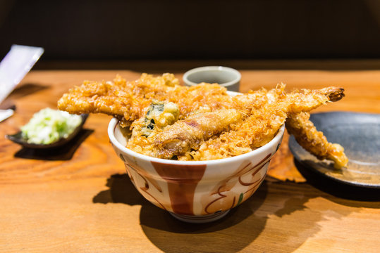 Delicious Seafood tempura tendon Japanese deep fried shrimp fish vegetables on rice with sweet sauce in the bowl