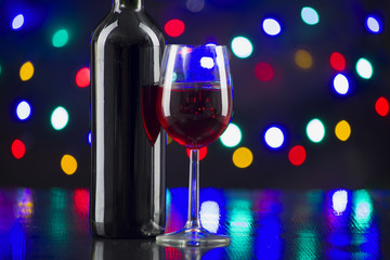 Two wine glasses clink at the party