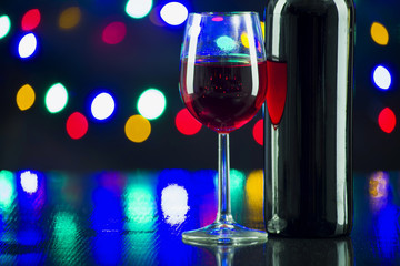 Two wine glasses clink at the party