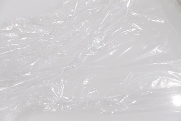 wrapping plastic transparent food film on white background.