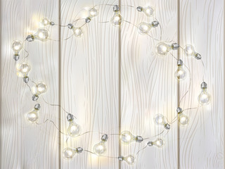 White vector wooden background with light bulbs.  rame of garland with edison's lamps.