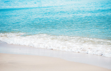 The beauty of nature in morning time of blue sea and sand,blurry light around.