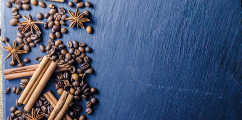 grains of coffee with cinnamon on sackcloth