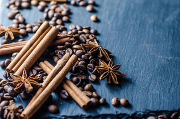 grains of coffee with cinnamon on sackcloth