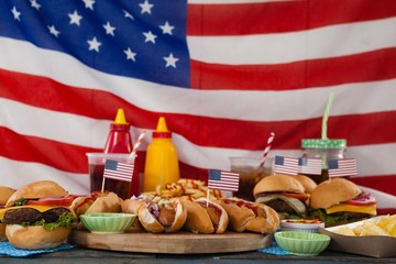 Drinks and snacks arranged on wooden table