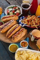 Snacks arranged on wooden table