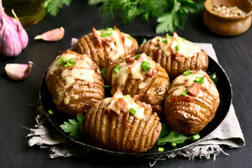 Baked potatoes with bacon, green onion and cheese