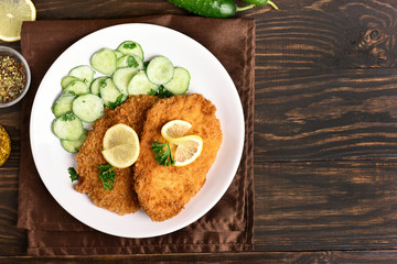 Schnitzel and cucumber salad, top view