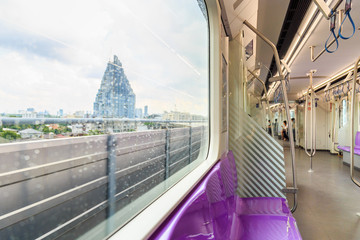 Picture of house and building view from inside the skytrain.