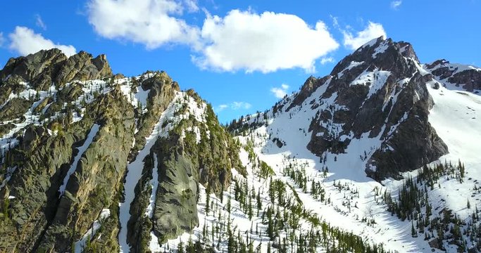 Sawtooth Mountains Idaho - Drone Aerial View Of Jagged Snowy Peaks With Pine Trees On The Slopes