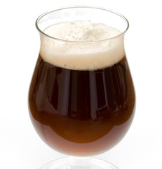 Black beer in chalice glass isolated on white background