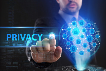 The concept of business, technology, the Internet and the network. A young entrepreneur working on a virtual screen of the future and sees the inscription: Privacy