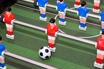 Foosball or Table Football. Selective focus. Plastic figures or foosball men made of plastic with black and white ball. 