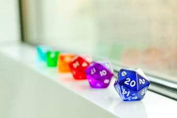 Different Dices for board games, near the window