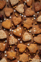 Gingerbread cookies on a wooden rustic background, traditional Christmas dessert, Christmas background