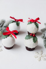 Christmas decorative dessert white chocolate and sugar mastic cupcake festive concept on white background