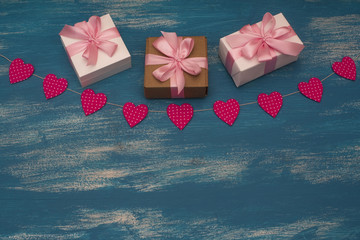 Valentine's day background with Decorative composition garland on painted wood background.