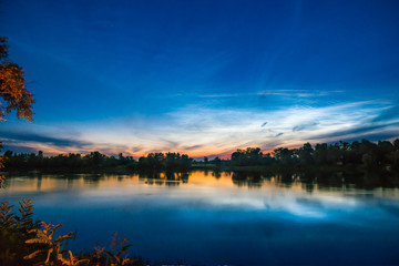 Sunset on a lake with forest
