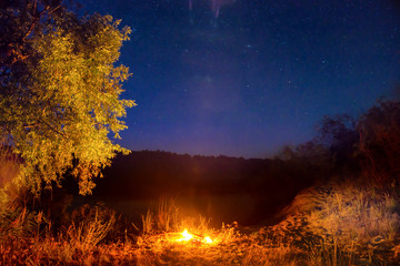 Fire at night in mountains